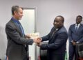 Minister of Finance Neal Rijkenberg shakes hands with a Tanzanian representative after the signing of the Memoranda of Understanding on cooperation in public sector accounting and financial reporting. Photo by Ministry of Finance, Eswatini.