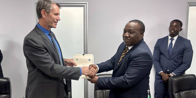 Minister of Finance Neal Rijkenberg shakes hands with a Tanzanian representative after the signing of the Memoranda of Understanding on cooperation in public sector accounting and financial reporting. Photo by Ministry of Finance, Eswatini.